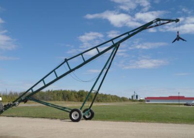 A hydraulic bin crane waiting to be extended.