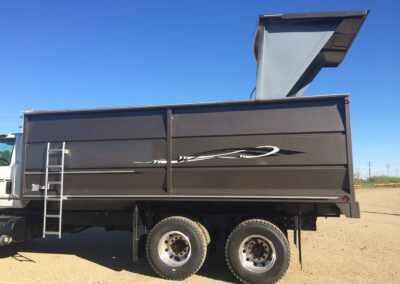 A custom grain trailer with hatch extended for grain.