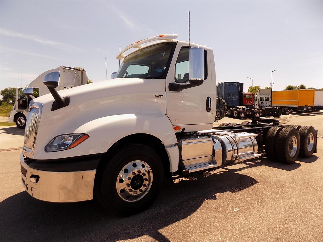 Close up of a white commercial truck cab.