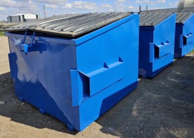 Blue commercial garbage bins available in Humboldt, Saskatchewan.